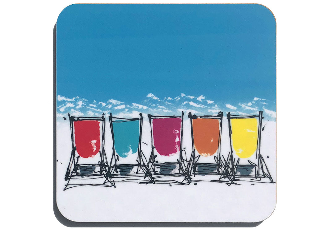 Colourful art coaster of 5 deckchairs in the snow with blue sky and mountain backdrop by artist Hannah van Bergen