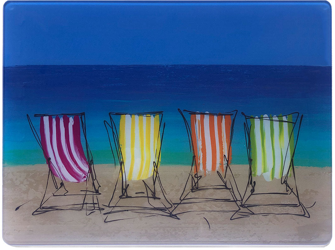 Glass platter / worktop saver with artwork of four stripey deckchairs on a beach with sea backdrop by artist Hannah van Bergen