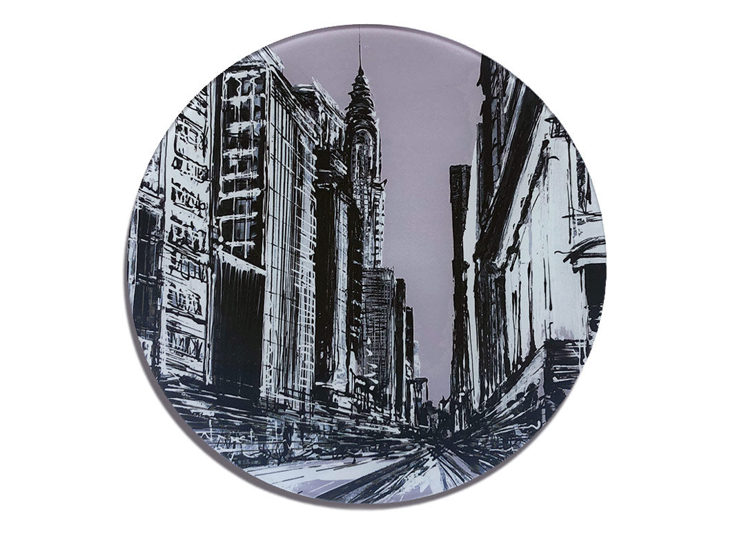 Round glass platter / worktop saver with greyscale artwork of a street scene in midtown New York featuring the Chrysler building by artist Hannah van Bergen