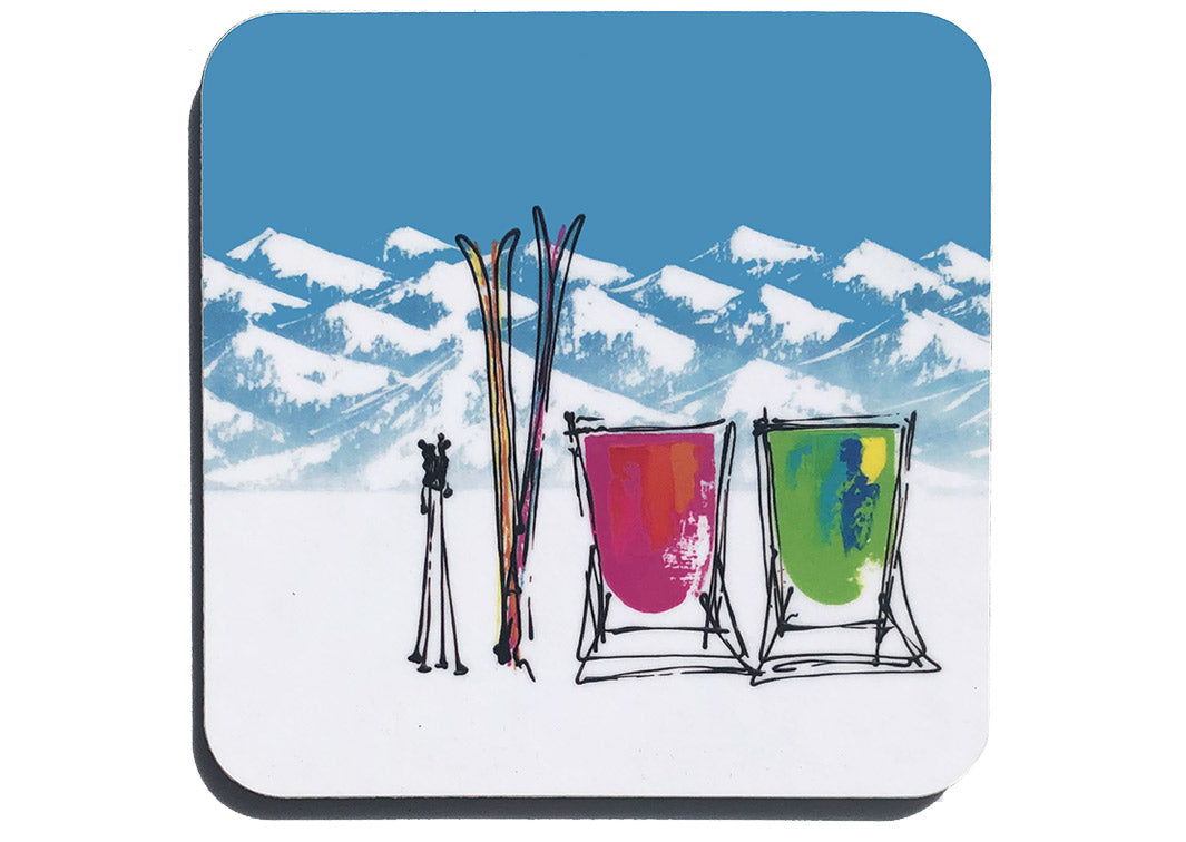 Colourful art coaster of 2 pink and green deckchairs in the snow with skis, poles and mountain backdrop by artist Hannah van Bergen