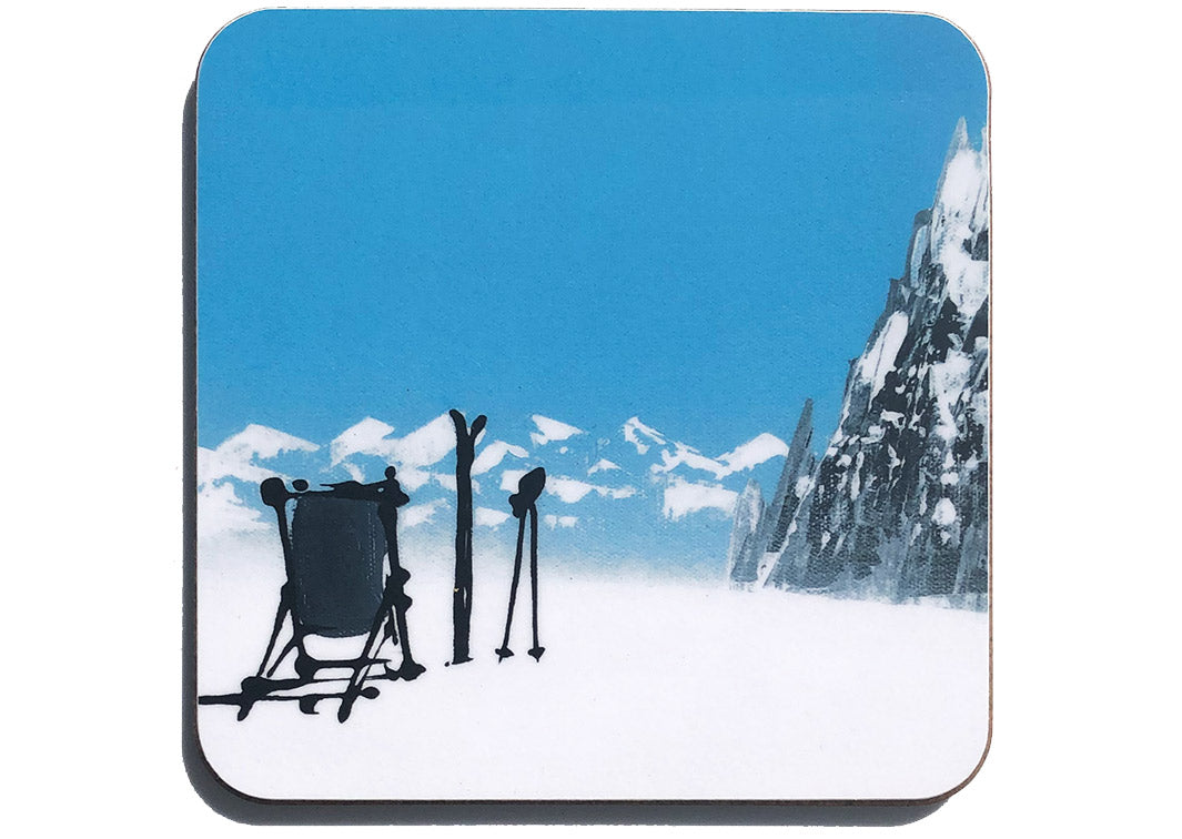 Art coaster of one deckchair in the snow with skis, poles and mountain backdrop by artist Hannah van Bergen