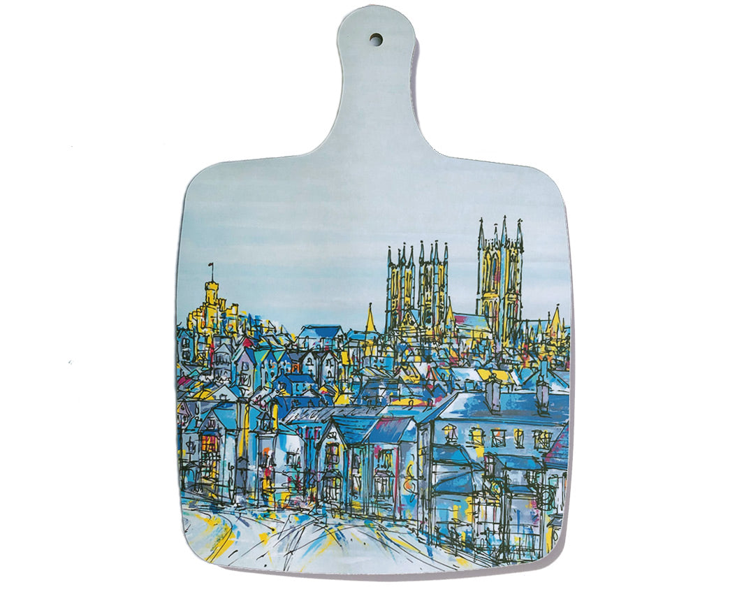 Melamine chopping board with handle featuring artwork of Lincoln castle and cathedral through the rooftops by artist Hannah van Bergen