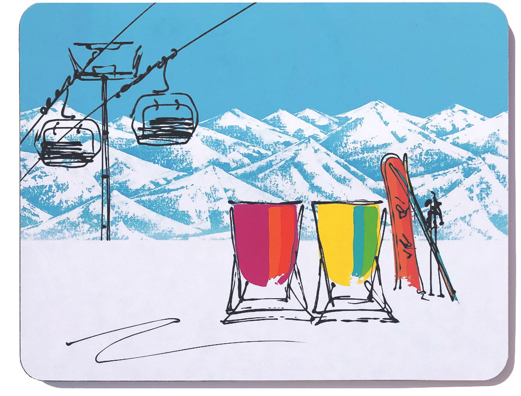 Rectangular melamine chopping board featuring 2 deckchairs in the snow with a snowboard and set of skis and chair lift by artist Hannah van Bergen