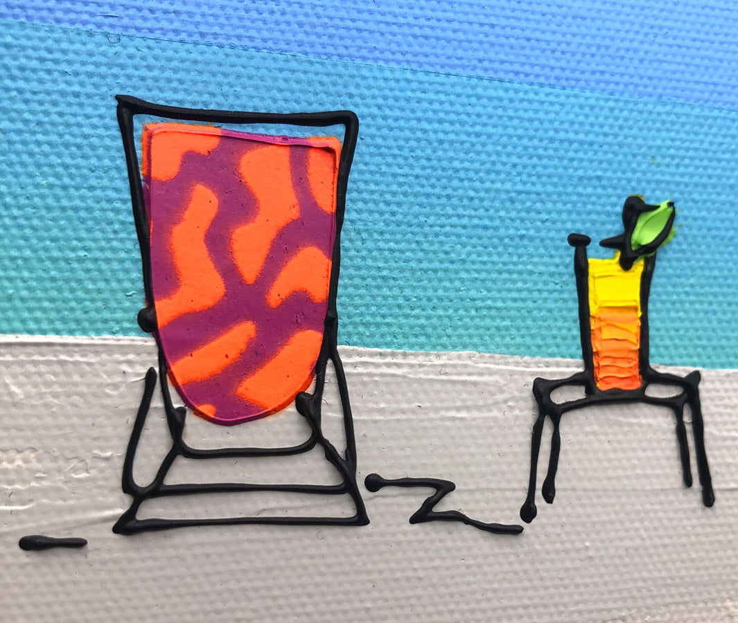 Close up of original textured mini canvas painting of a colourful deckchair and cocktail on the beach with blue sky by artist Hannah van Bergen