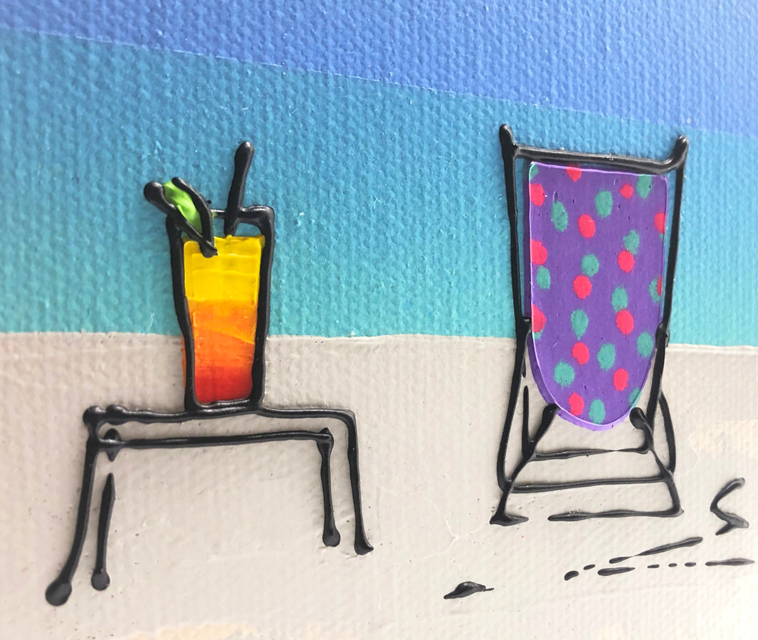 Close up of original textured mini canvas painting of a colourful deckchair and cocktail on the beach with blue sky by artist Hannah van Bergen