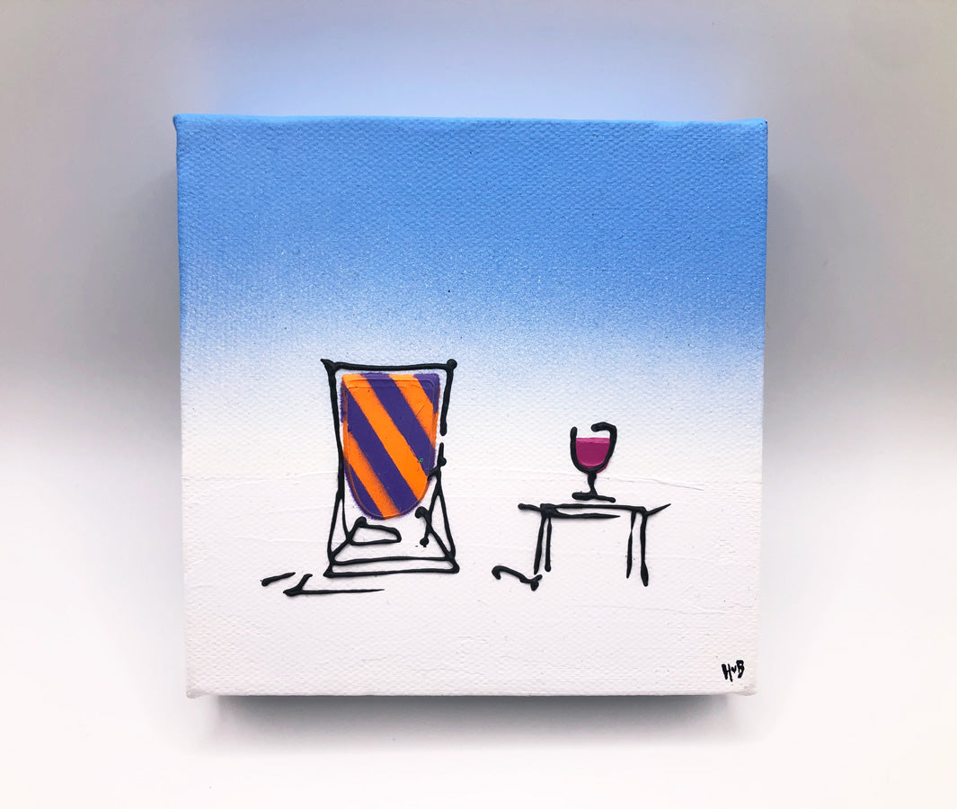 Original textured mini canvas painting of a colourful deckchair in the snow with a drink and blue sky by artist Hannah van Bergen