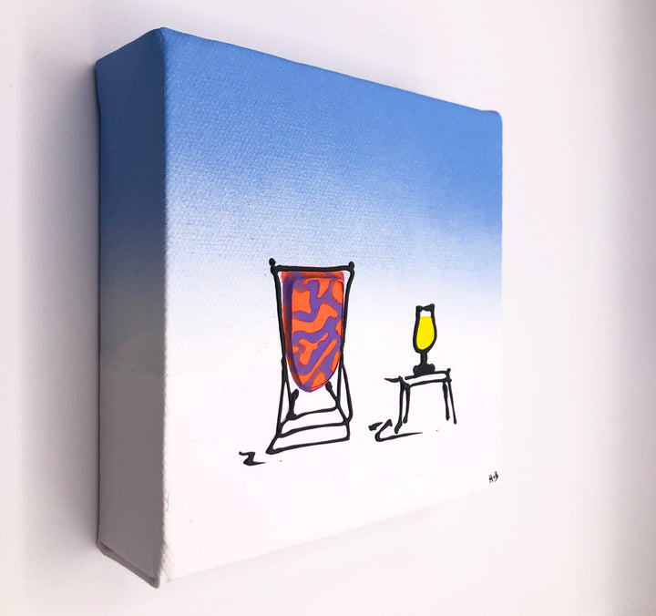 Original textured mini canvas painting of a colourful deckchair in the snow with a drink and blue sky by artist Hannah van Bergen