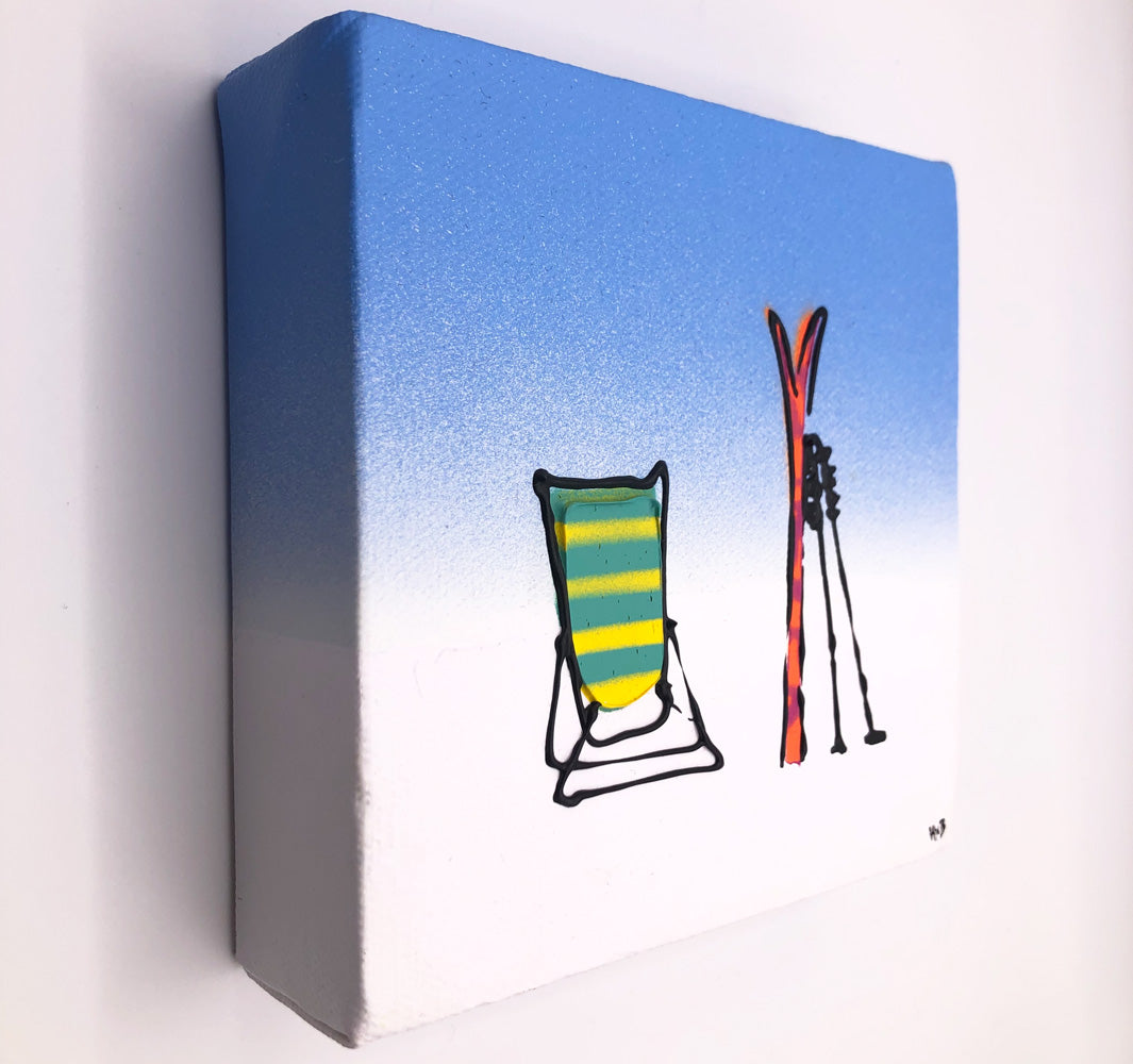 Original textured mini canvas painting of a deckchair, skis and poles in the snow with blue sky by artist Hannah van Bergen