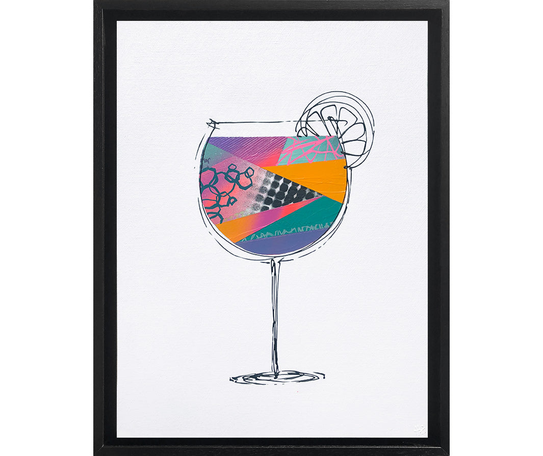 Framed painting of a colourful, textured cocktail glass on a white background with a black frame by artist Hannah van Bergen
