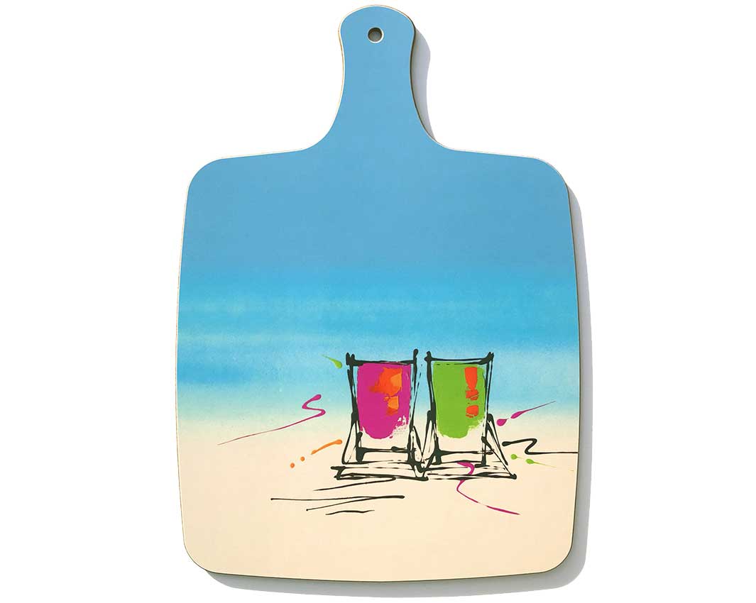 Chopping board with handle featuring artwork of 2 deckchairs on the beach by artist Hannah van Bergen
