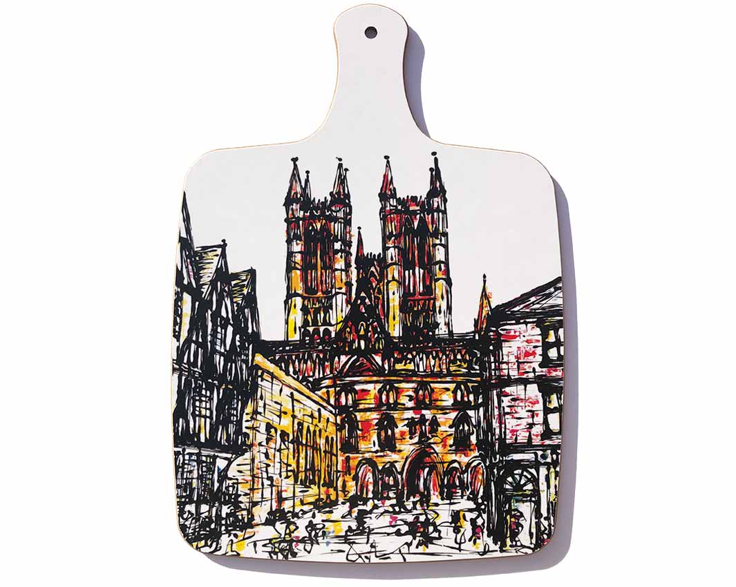 Chopping board with handle featuring artwork of Lincoln Cathedral and Castle Square by artist Hannah van Bergen